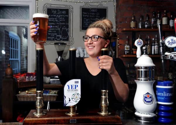 Alex Nelson pulls a pint of Leeds Brewery's YEP 125 years of the Yorkshire Evening Post ale, which is on sale at the Midnight Bell in Leeds.