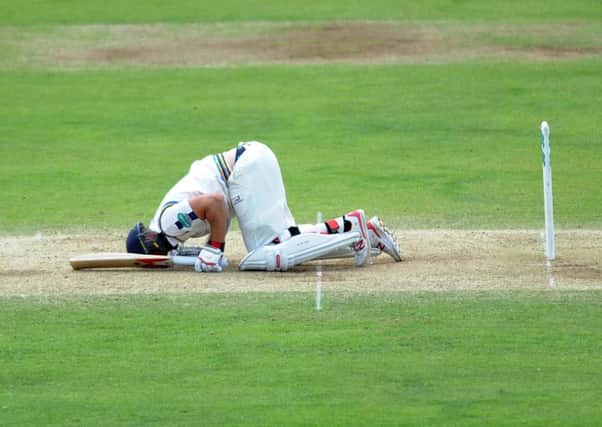 DOWNED: Yorkshire's Tim Bresnan lies on the floor after being struck in the box as the hosts tumbled to defeat to Middlesex at Scarborough on Wednesday. Picture : Jonathan Gawthorpe