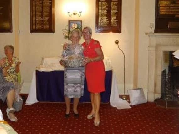 Mary Durrans, left, with Huddersfield lady captain Liz Roberts.