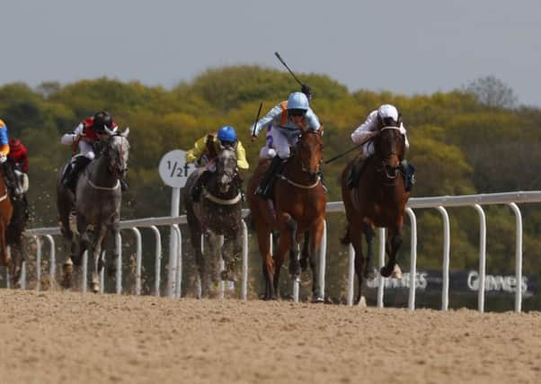Tawdeea and jockey Sam James (second right) wins the Best Odds Guaranteed At 188BET Handicap at Newcastle Racecourse.