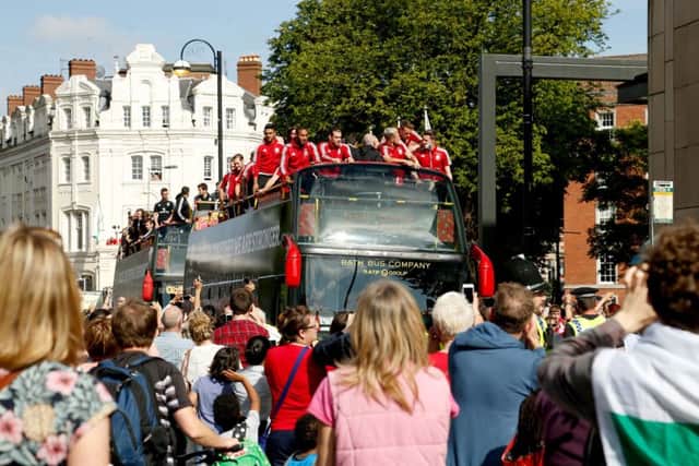 Wales players acknowledge the fans on a open top bus during the homecoming in Cardiff city centre. Picture: Paul Harding/PA Wire.