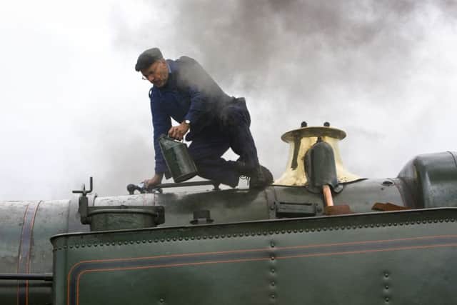 A rail operations volunteer working on one of the locomotives during a previous steam gala.