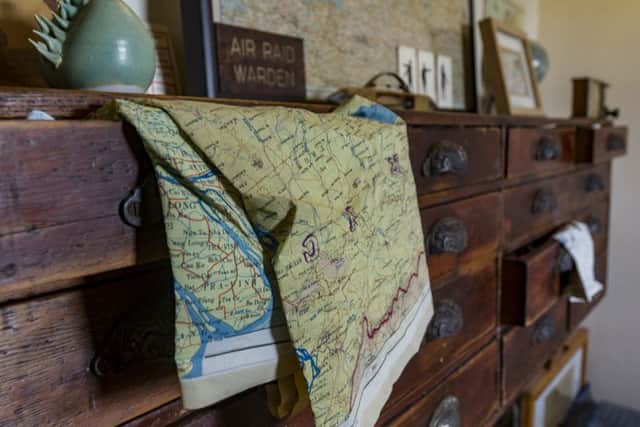 These vintage drawers came from a haberdashery and are perfect for storing  the escape and evasion maps