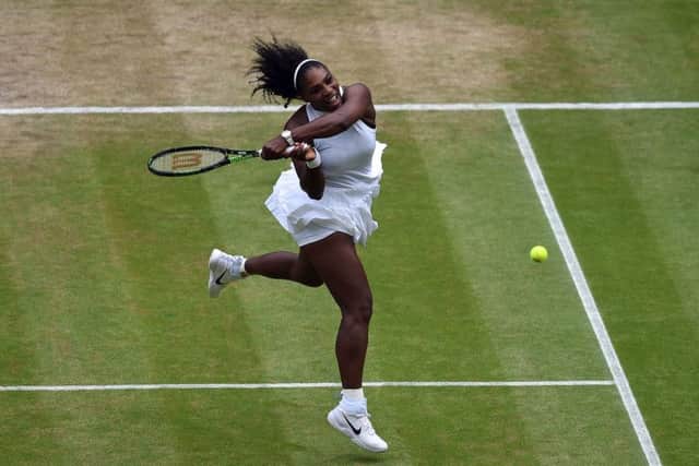 Serena Williams smashes a backhand pass down the line against Angelique Kerber on Saturday. Picture: Andy Rain/PA.