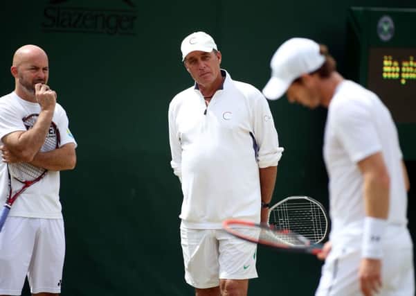 Andy Murray's coaches Jamie Delgado (left) and Ivan Lendl (centre) watch on during a practice session. Picture: Steve Paston/PA.