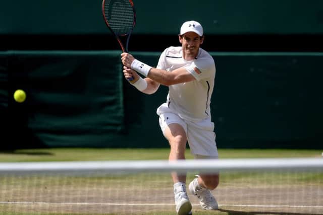 Andy Murray hits a backhand winner against Milos Raonic. Picture: Anthony Devlin/PA