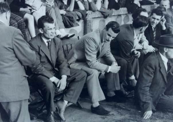 RESPECT: Alex Murphy and Mick Sullivan, left, sit alongside each other during the 1960 Championship semi final between St Helens and Wigan having earlier being sent off for fighting each other. Picture submitted.