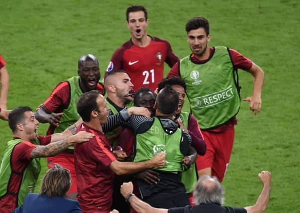 Portugal players celebrate after Eder, centre, had scored the only goal of the Euro 2016 final against hosts France. Portugal had lost their captain Cristiano Ronaldo to injury midway through the first half of normal time in the tournaments climax (Picture: Joe Giddens/PA).