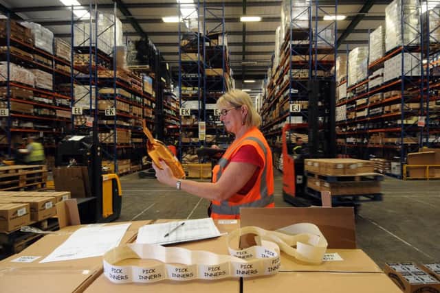 Debbie Coombes checks the brands in the Suma warehouse. Picture by Simon Hulme.