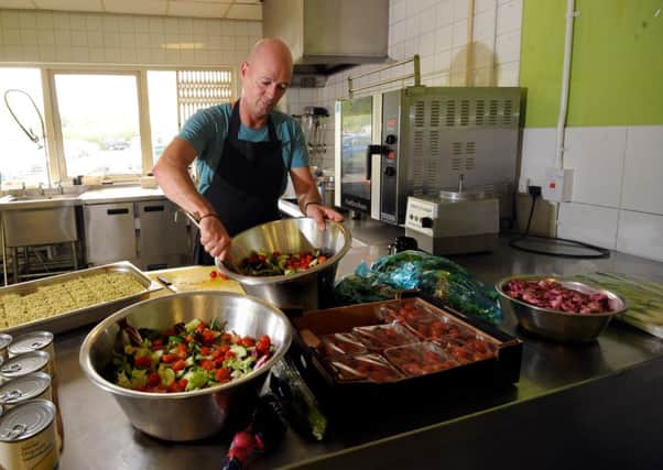 Suma Foods in Elland disproves the old adage that there is no such thing as a free lunc. Paul Collins pictured preparing food in the canteen. Picture by Simon Hulme