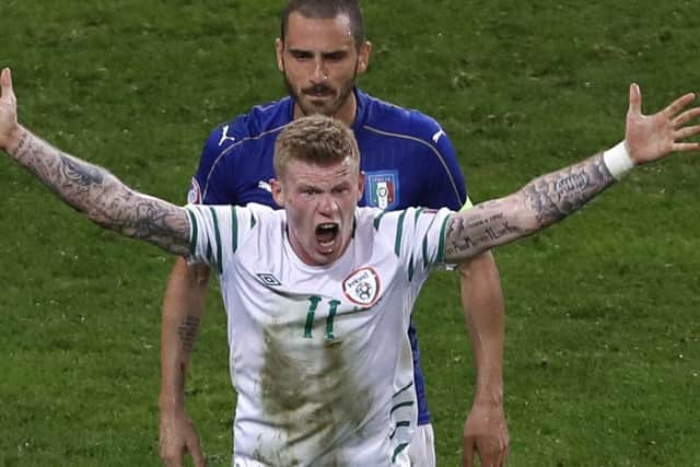 Italy's Leonardo Bonucci marks Ireland's James Mcclean. Picture: AP/Darko Vojinovic