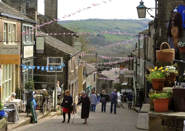 Haworth
Main Street in Haworth decked in bunting to celebrate the 200th anniversary of the birth of Charlotte BrontÃ«.  Picture by Tony Johnson