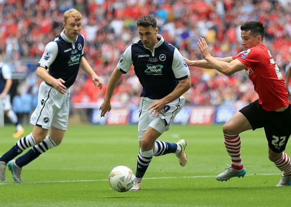 Millwall's Lee Gregory (centre) in action againt Barnsley during the Sky Bet League One Play-Off Final at Wembley Picture: Nigel French/PA.
