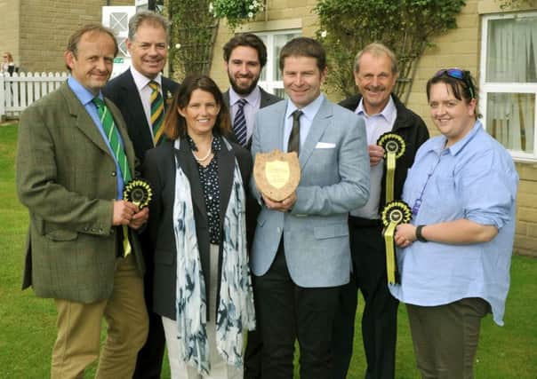 The Yorkshire Post's Farmer of the Year Award ceremony: The winner Jeremy Holmes (centre) receives the award from Julia  Rangecroft of award sponsor Millls & Reeve with (L-R) Will Terry, Nick Lane Fox from the Yorkshire Agricultural Society, Ben Barnett, The Yorkshire Post's Agricultural Correspondent,  Denys Fell and Rebecca Burniston.