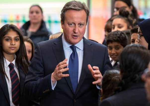 Prime Minister David Cameron meets pupils during a visit to the Reach Academy in West London, after he bid farewell to his top team by chairing an "emotional" final Cabinet meeting. (Chris J Ratcliffe/PA Wire).