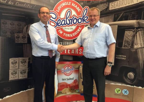 LAND SALE: Mike Dove, partner at Leeds-based property agent Dove Haigh Phillips (left), and Jonathan Bye, chief executive of Seabrook Crisps. The company has sold redundant land to invest in its expansion plans.