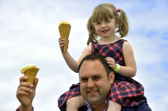 Charlotte Rowson, daughter of the National Farmers Union North East Dairy Chairman  Tom Rowson, both enjoying some Brymor ice cream at the Great Yorkshire Show.