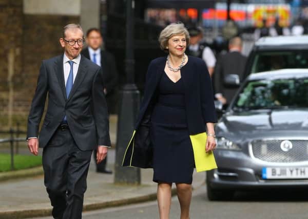 New Prime Minister Theresa May and her husband Philip John arrive at 10 Downing Street, London, after Mrs May met Queen Elizabeth II and accepted her invitation to become Prime Minister and form a new government. Gareth Fuller/PA Wire