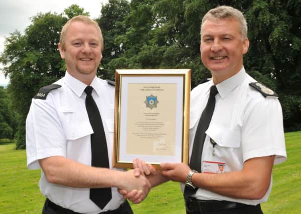 Police Bravery Awards nominee PC Sean Cannon received a commendation from West Yorkshire's Chief Fire Officer Simon Pilling last month. Picture: West Yorkshire Fire and Rescue Service.