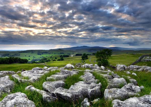 A view across to Ingleborough from the limestone outcrops above Stainforth as the sun goes down.  Picture: Bruce Rollinson.