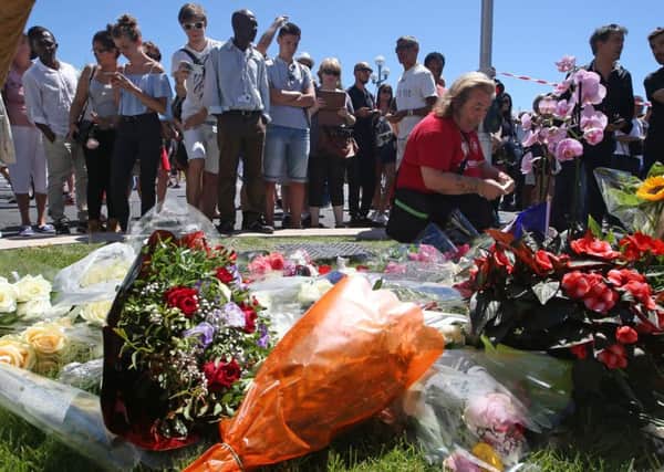 Floral tributes are laid out near the site of the truck attack in Nice. (AP Photo/Luca Bruno)
