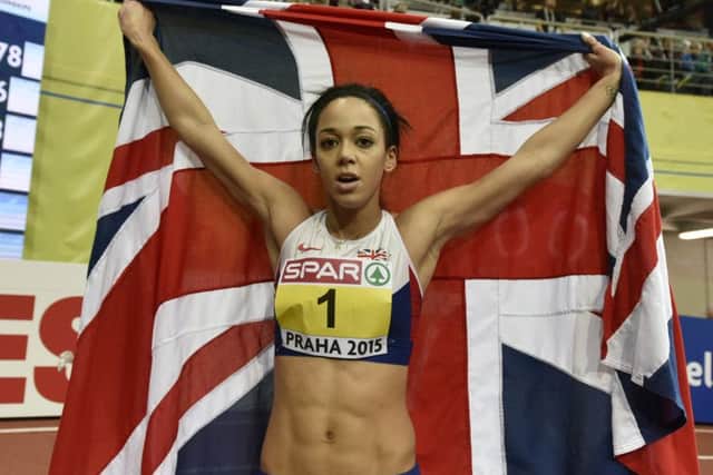 Britain's Katarina Johnson-Thompson celebrates with a British flag after winning the gold medal in the women's pentathlon at the European Athletics Indoor Championships in Prague last year. 2015. Picture: AP/Martin Meissner