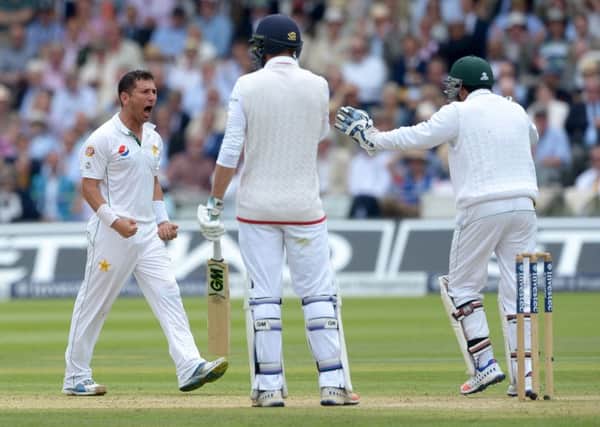 Pakistan's Yasir Shah celebrates taking the wicket of England's James Vince, centre, during day two of the Investec Test at Lord's (Picture: Anthony Devlin/PA Wire).