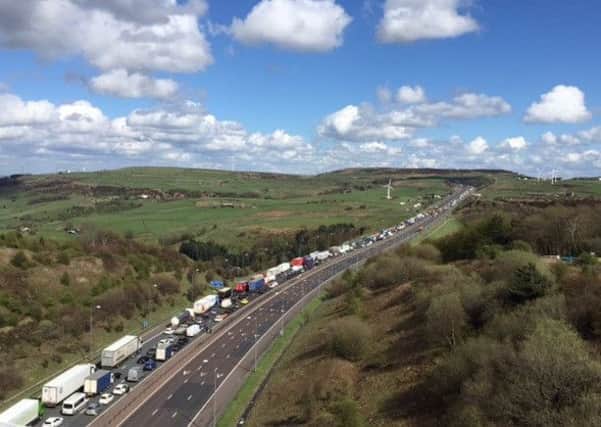 File pic: Queues on the M62 viewed from Scammanden Bridgeb following a previous crash involving two HGVs