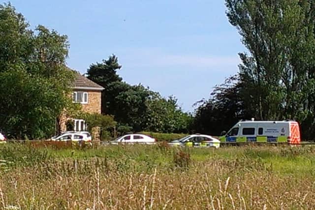 The scene at Grange Farm, Seaton, this afternoon, where detectives have launched a murder investigation
