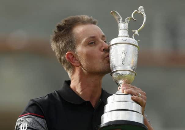 Sweden's Henrik Stenson celebrates with the Claret Jug after winning the Open Championship at Royal Troon (Picture: Danny Lawson/PA Wire).