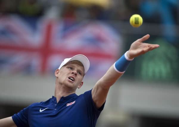 HERO OF THE HOUR: Beverley's Kyle Edmund serves to Serbia's Dusan Lajovic during their Davis Cup clash in Belgrade on Sunday. Picture: AP /Marko Drobnjakovic.