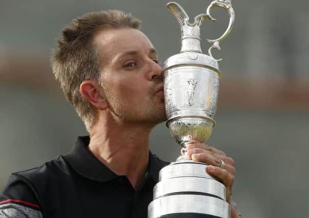 Sweden's Henrik Stenson celebrates with the Claret Jug after winning the Open Championship. (PA).