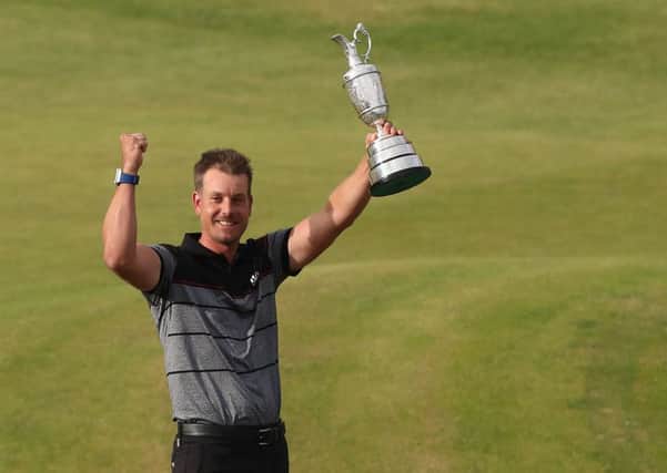 Sweden's Henrik Stenson celebrates with the Claret Jug after winning the Open Championship at Royal Troon (Picture: Peter Byrne/PA Wire).