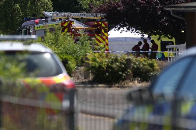 Emergency services at the scene near Castle Swimming Pool in Spalding, Lincolnshire, after three people including a suspected gunman have been shot dead.
