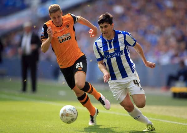 Hull City's Michael Dawson, left, is out for three months