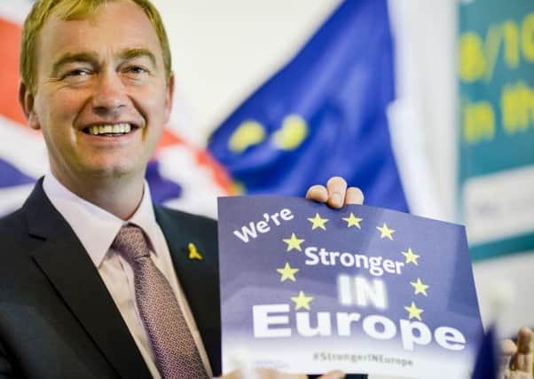 Tim Farron holds a flyer at the Liberal Democrats annual conference last year. (PA).