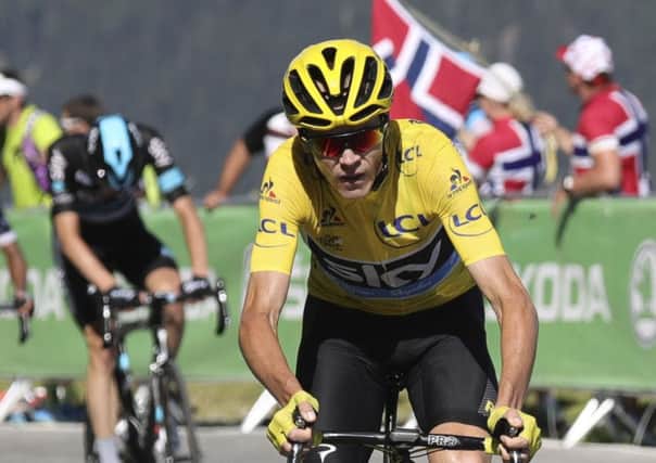Britain's Chris Froome, wearing the overall leader's yellow jersey, breaks away from Colombia's Nairo Quintana, rear left, during the seventeenth stage of the Tour de France. Picture: Kenzo Tribouillard/AP