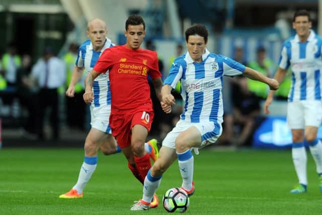 PREPARATIONS: Huddersfield Town's Joe Lolley battles with Liverpool's Philippe Coutino. Picture: Tony Johnson.