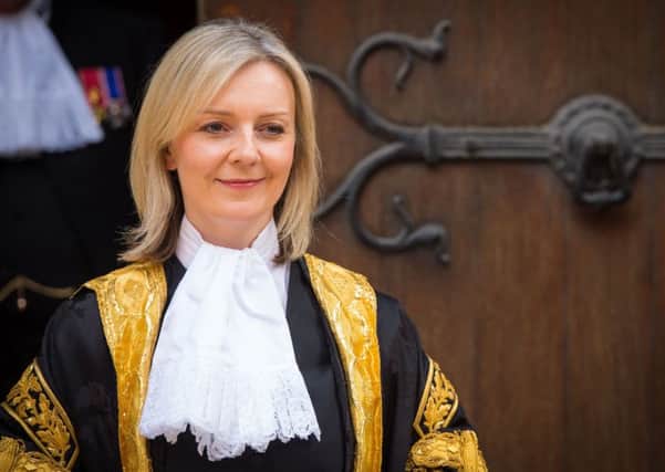 The new Lord Chancellor Liz Truss, the first woman ever to hold the role, at the Judge's entrance to the Royal Courts of Justice, in central London before being installed. Dominic Lipinski/PA Wire