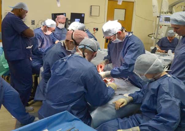 Professor Simon Kay and his team as they perform the UK's first double hand transplant at Leeds General Infirmary, on patient Chris King, from Doncaster. Credit: Leeds Teaching Hospitals NHS Trust
/PA Wire