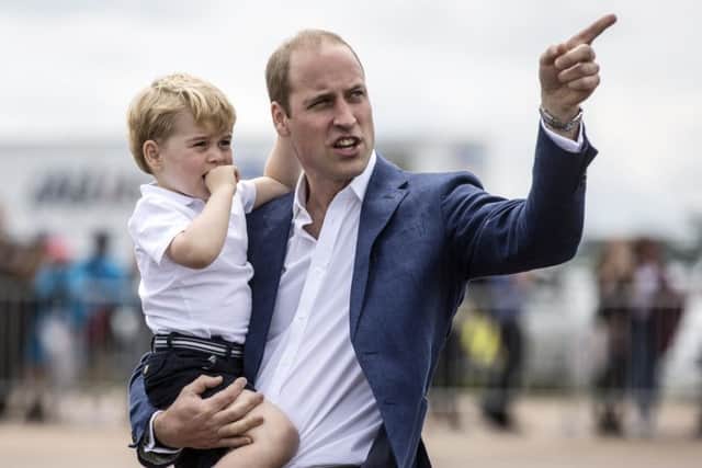 Prince George with his father the Duke of Cambridge, as the Prince celebrates his third birthday today. Picture: Richard Pohle/The Times/PA Wire