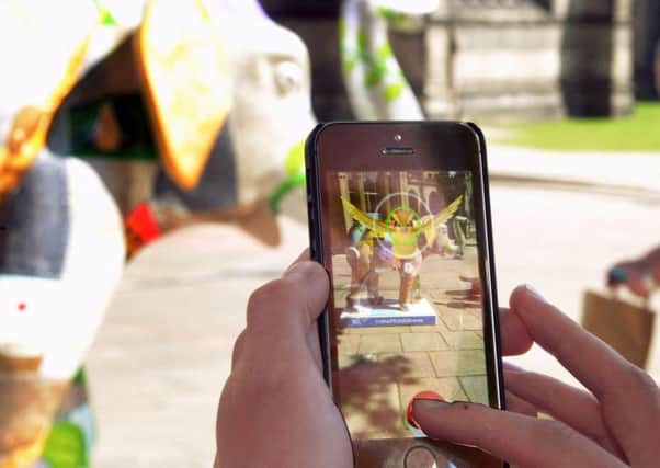 The Pokemon Go app projects an artificial layer onto your actual surroundings