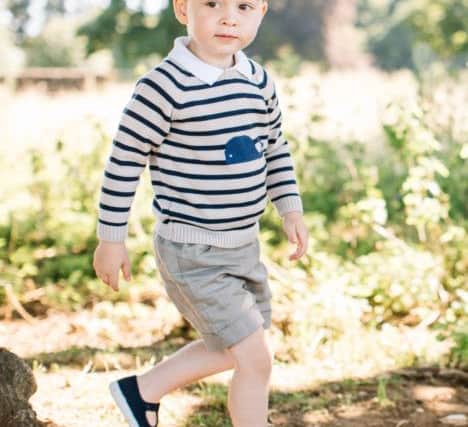 Picture released by the Duke and Duchess of Cambridge of Prince George, who celebrates his third birthday today. The picture was taken at the family's Norfolk home in mid-July by Matt Porteous.