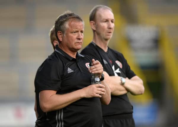 Sheffield United manager Chris Wilder and assistant Alan Knill watch their side in action against FC Halifax Town (Picture: Bruce Rollinson).