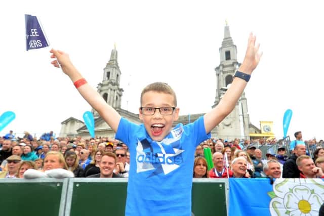 12 June 2016.......       Young Bailey Matthews cheers on the Brownlee Brothers at the  2016 ITU World Triathlon Leeds  in Millenium Square.  Picture Tony Johnson