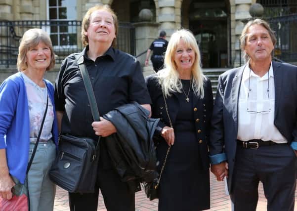 Richard Westwood, 73 (second left)  and Leonard "Chip" Hawkes, 70, who were members of the 1960s pop group The Tremeloes, stand with their wives, Lynn (left and Carol,  outside Reading Crown Court after they were formally acquitted of indecently assaulting a 15-year-old girl after a gig nearly 50 years ago.