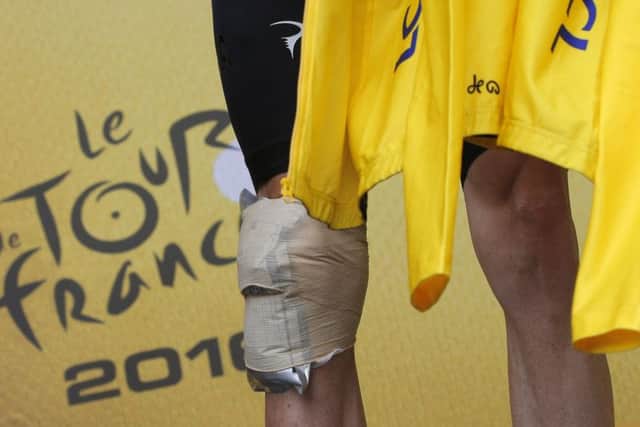 OUCH: The knee of overall Tour de France leader, Chris Froom, bandaged after his crash on stage 19. Picture: AP/Christophe Ena