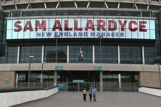 A large digital display reads "Sam Allardyce New England Manager" at Wembley Stadium, London.