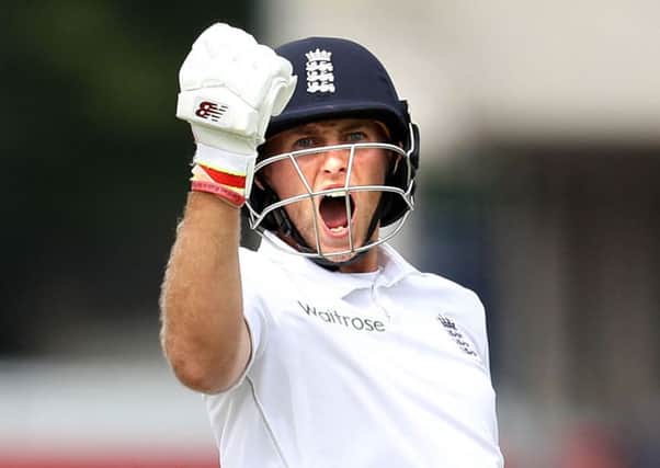 England's Joe Root celebrates his double century against Pakistan