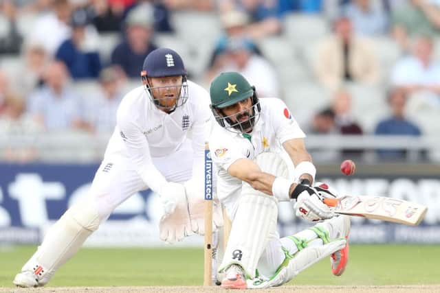 Pakistan's Misbah-ul-Haq lofts the ball to be caught by England's Alastair Cook, watched by England's Jonny Bairstow. Picture: Martin Rickett/PA.